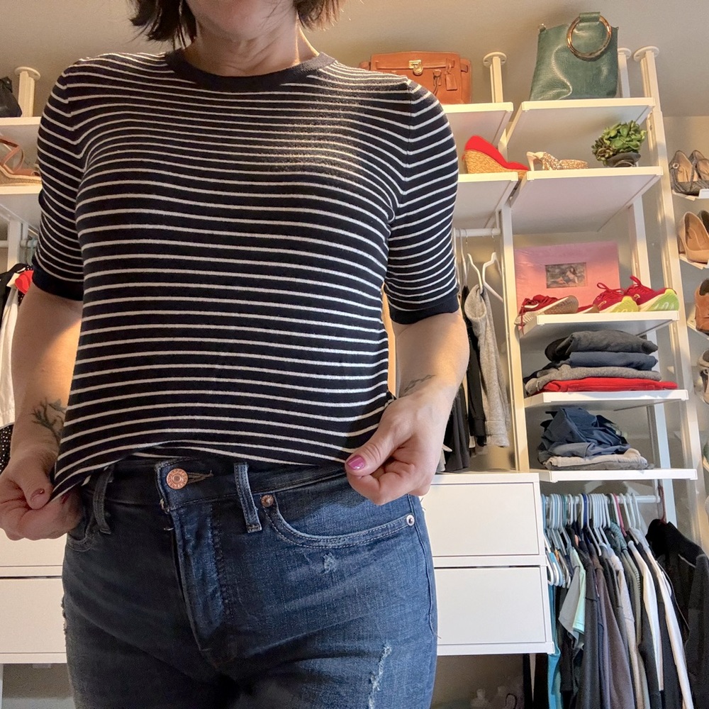 Philosophy Size Small blue and white short sleeved sweater.